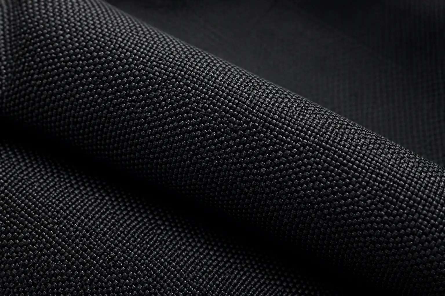 Black textured fabric used for quality control and material inspection