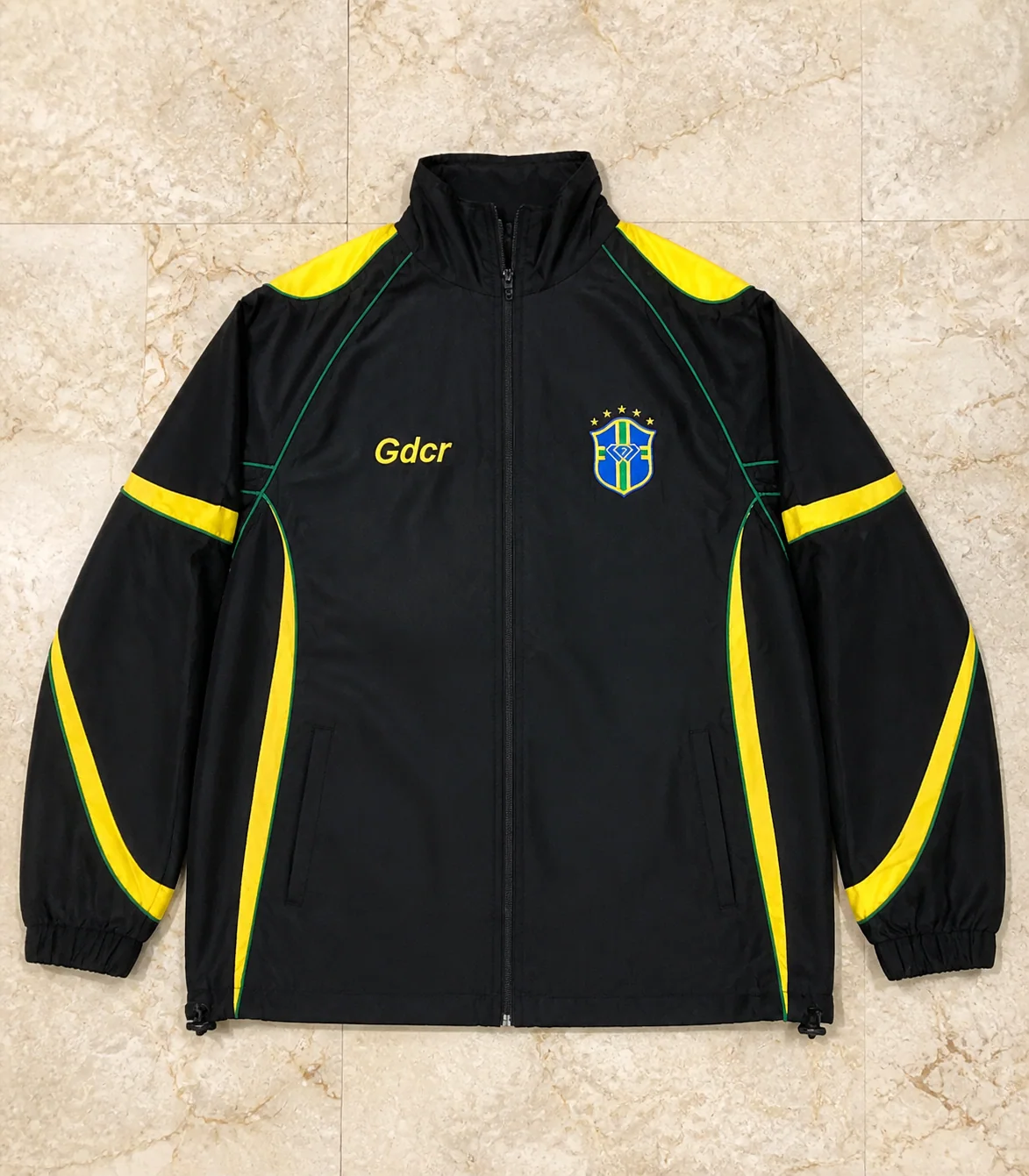 Black and yellow custom colour-block jacket on marble