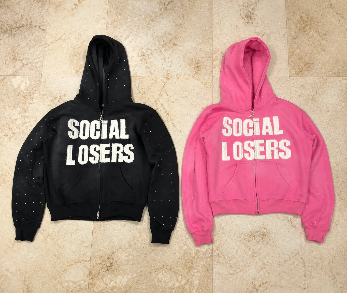 Black and pink zip hoodies with rhinestones and white appliqué lettering