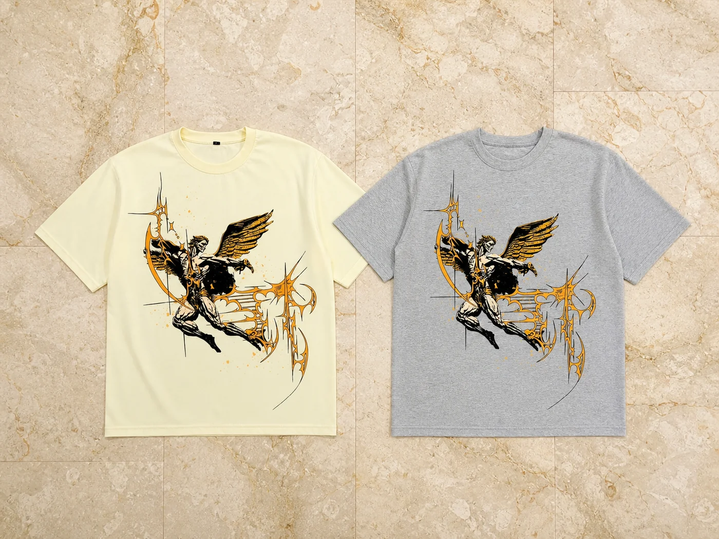 Cream and grey oversized graphic t-shirt samples on marble